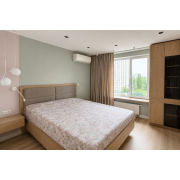 Bed with hanging bedside tables and display cabinet